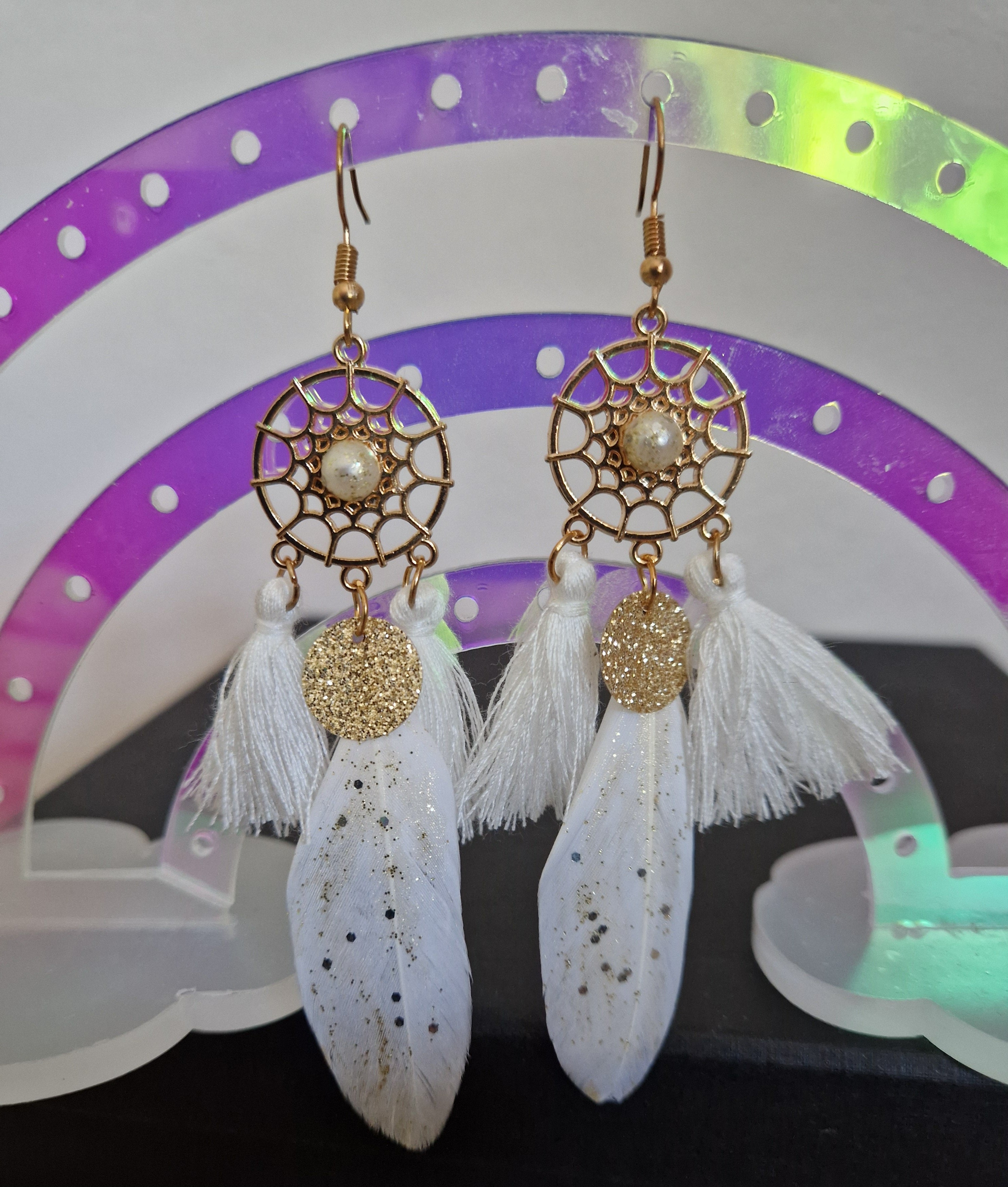 Attrape rêve et pompons blancs